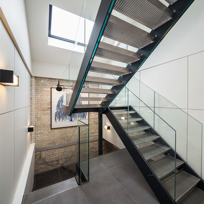 Trendy metal straight open staircase photo in London