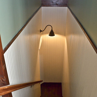 Example of a mid-sized classic wooden l-shaped wood railing staircase design in Orange County with wooden risers