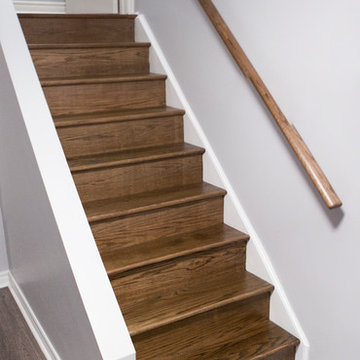 Basement Stained Hardwood stairs and handrail