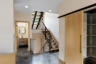 Example of a small trendy wooden floating staircase design in Other