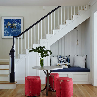 Example of a mid-sized beach style wooden l-shaped staircase design in San Diego with painted risers