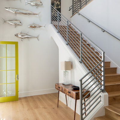 Beach style wooden l-shaped metal railing staircase photo in Miami with wooden risers