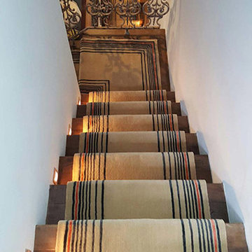Beige Carpet Installation With Some Stripes to Stairs