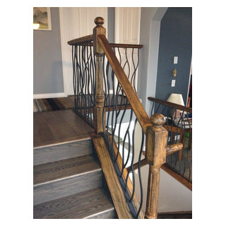 BENT iron design interior railing with a distressed wood handrail and ...