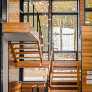 Staircase - large rustic wooden u-shaped open and cable railing staircase idea in Boston