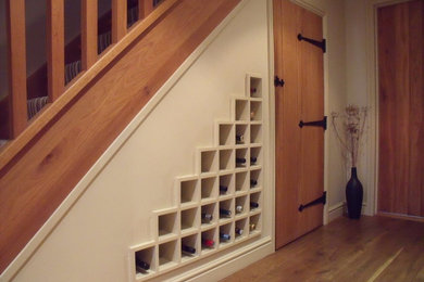 Inspiration for a farmhouse staircase in West Midlands with under stair storage.