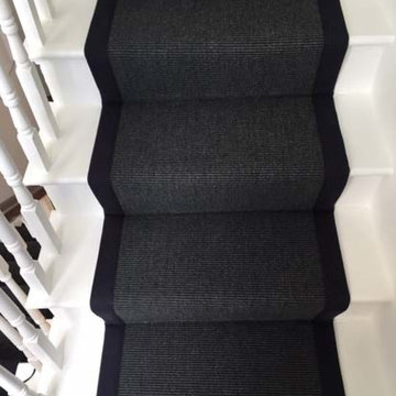Black Carpet with Black Binding Installed to Stairs