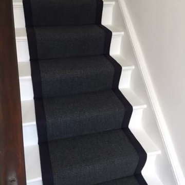 Black Carpet with Black Binding Installed to Stairs