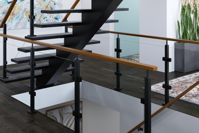 Foto de escalera minimalista con barandilla de varios materiales