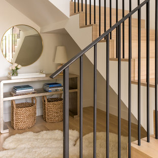 Mid-sized trendy wooden l-shaped metal railing staircase photo in Dallas with wooden risers