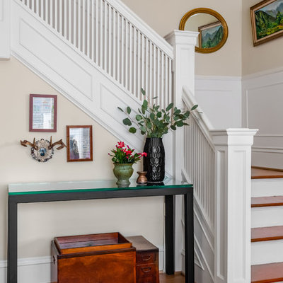 Mid-sized eclectic wooden l-shaped wood railing staircase photo in Seattle with painted risers