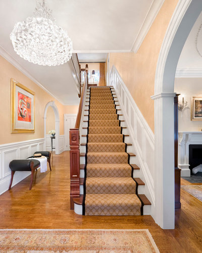 American Traditional Staircase by CHRISICOS INTERIORS