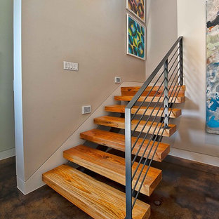 Staircase - contemporary wooden floating open and metal railing staircase idea in Austin