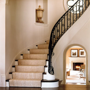 Example of a classic wooden curved staircase design in DC Metro with wooden risers