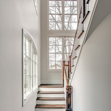 Bright, White Stairwell with Warm Woods