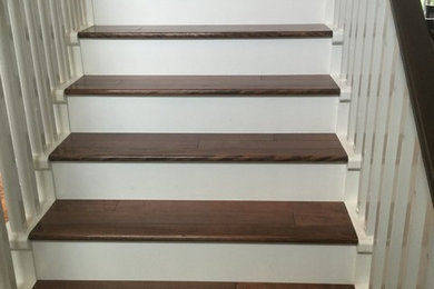 Inspiration for a mid-sized country wooden straight wood railing staircase remodel in Vancouver with painted risers