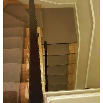 Brown Carpet Runner With Border to Stairs