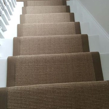 Brown Carpet with Brown Edgings Installed to Stairs
