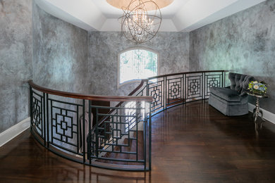Staircase - large contemporary wooden curved mixed material railing staircase idea in New York with wooden risers