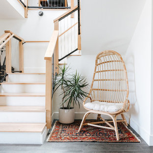 This is an example of a contemporary wood mixed railing staircase in Other with painted wood risers.