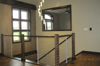 Example of a mid-sized classic carpeted u-shaped staircase design in Other with carpeted risers