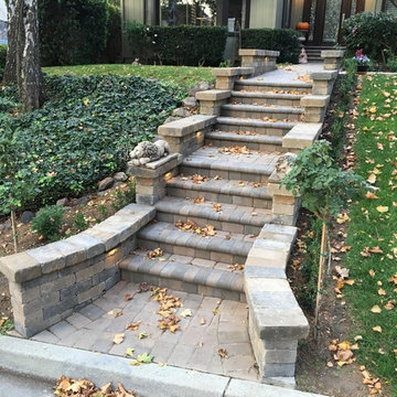 Calstone Antiqued Cobble Paver with Bullnose and Roman Stone Front Steps
