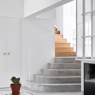 This is an example of a beach style concrete staircase in Brisbane with concrete risers.