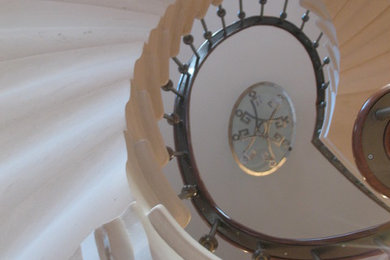This is an example of a large traditional spiral staircase in Kent.