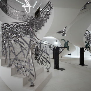 Inspiration for a bohemian spiral metal railing staircase in London.