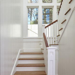 Mid-sized beach style wooden l-shaped staircase photo in San Francisco with painted risers