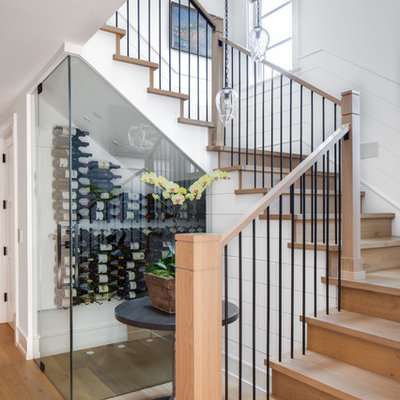 Inspiration for a mid-sized contemporary wooden u-shaped mixed material railing staircase remodel in Los Angeles with wooden risers