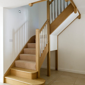 Carpeted Staircase with Stainless Steel Spindles