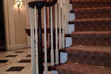 Example of a mid-sized curved staircase design in Baltimore