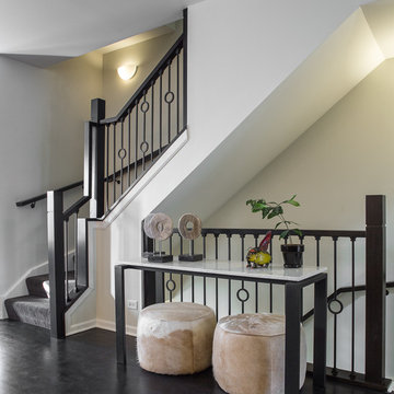 Carpeted Wood and Wrought-Iron Staircase