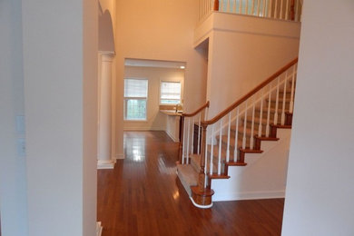 Mid-sized transitional carpeted l-shaped staircase photo in Charlotte with carpeted risers