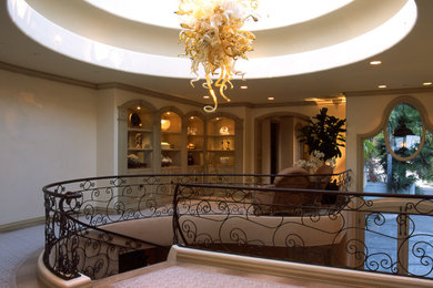 Inspiration for a huge transitional spiral metal railing staircase remodel in Orange County