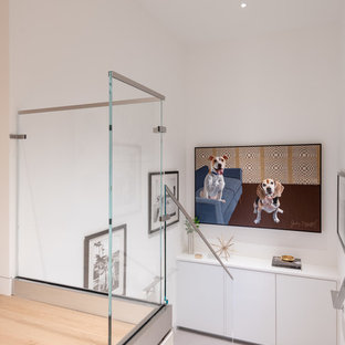 Trendy carpeted u-shaped glass railing staircase photo in San Francisco with carpeted risers