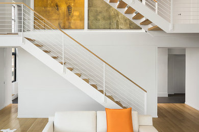 Inspiration for a scandinavian wooden straight staircase remodel in Boston