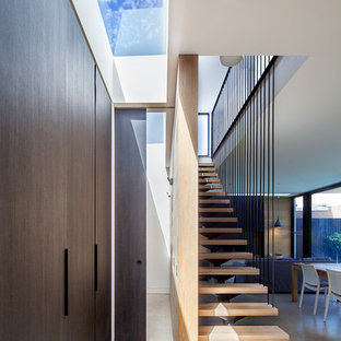 Inspiration for a contemporary wood straight staircase in Melbourne with open risers.