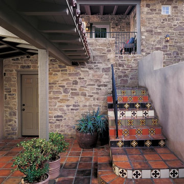 Colorful Tile Staircase with Rustic Stone and Mediterranean Feel