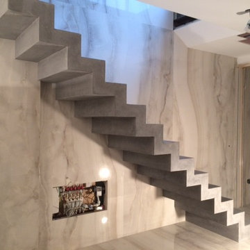 Coloured, polished concrete, stepped soffit stairs