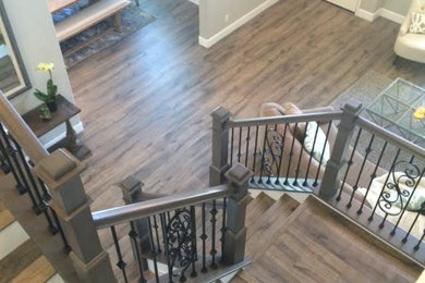 Trendy wooden u-shaped mixed material railing staircase photo in Los Angeles with painted risers