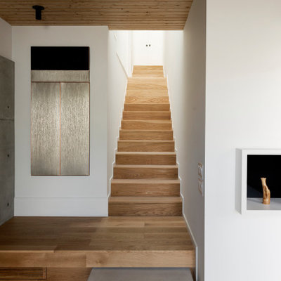 Staircase - modern wooden straight staircase idea in Houston with wooden risers