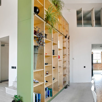Contemporary bookcase and staircase storage