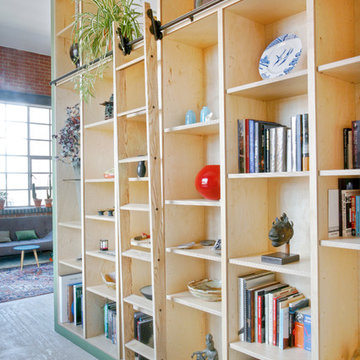 Contemporary bookcase and staircase storage