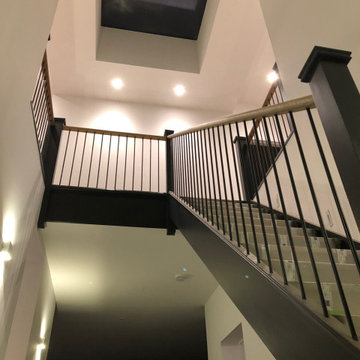 Contemporary Open Riser Stairs with Metal Spindles