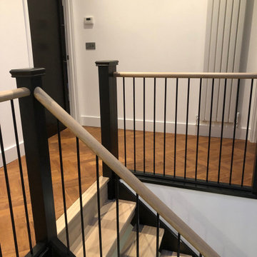 Contemporary Open Riser Stairs with Metal Spindles