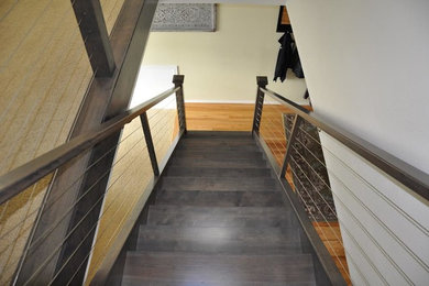Staircase - mid-sized rustic wooden floating open and mixed material railing staircase idea in Seattle