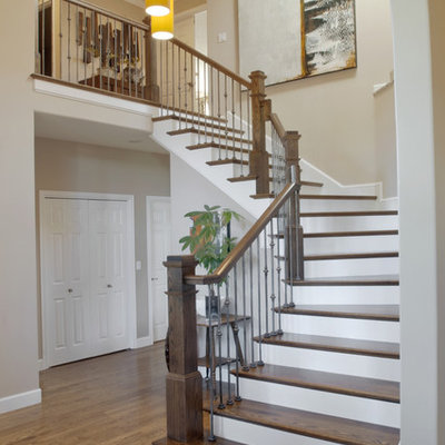 Example of a trendy wooden staircase design in Other