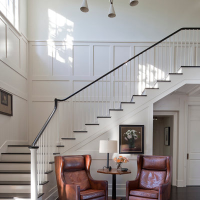 Example of a transitional painted l-shaped staircase design in Other with painted risers
